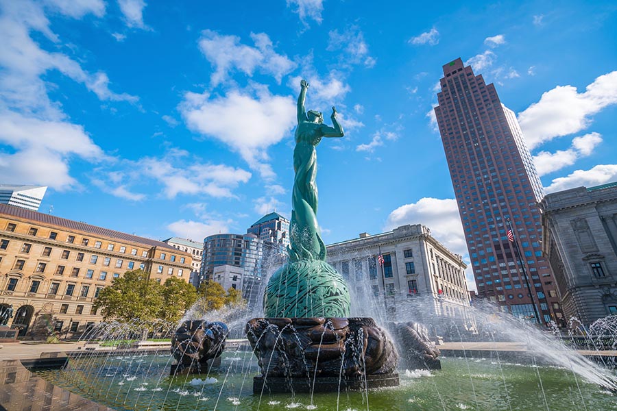 About Our Agency - Historic Fountain of Eternal Life in Downtown Cleveland, Ohio, With Buildings Rising Behind It, on a Sunny Day